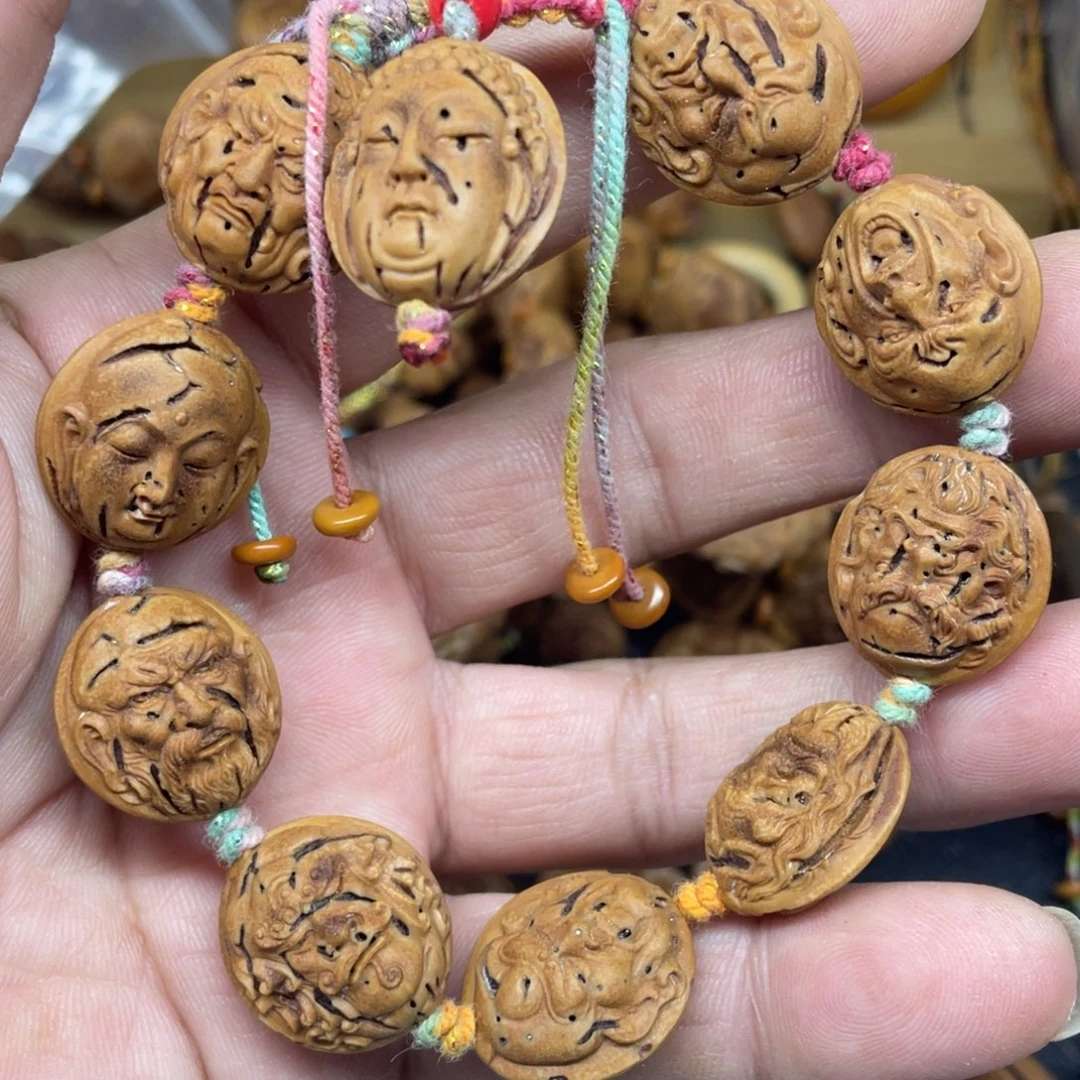 桃核雕刻罗汉手串