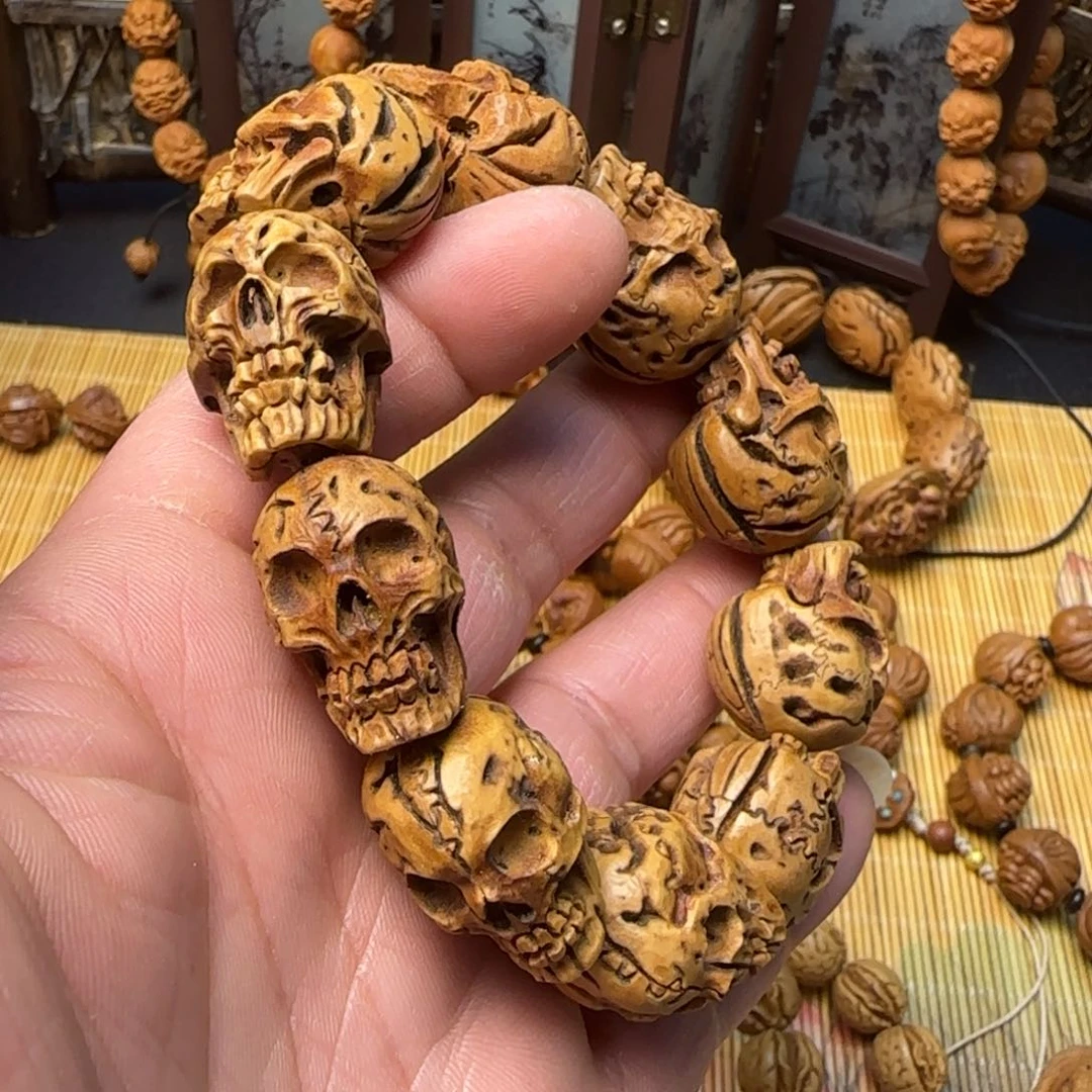 纯手工雕刻大桃核骷髅头手串一物一图