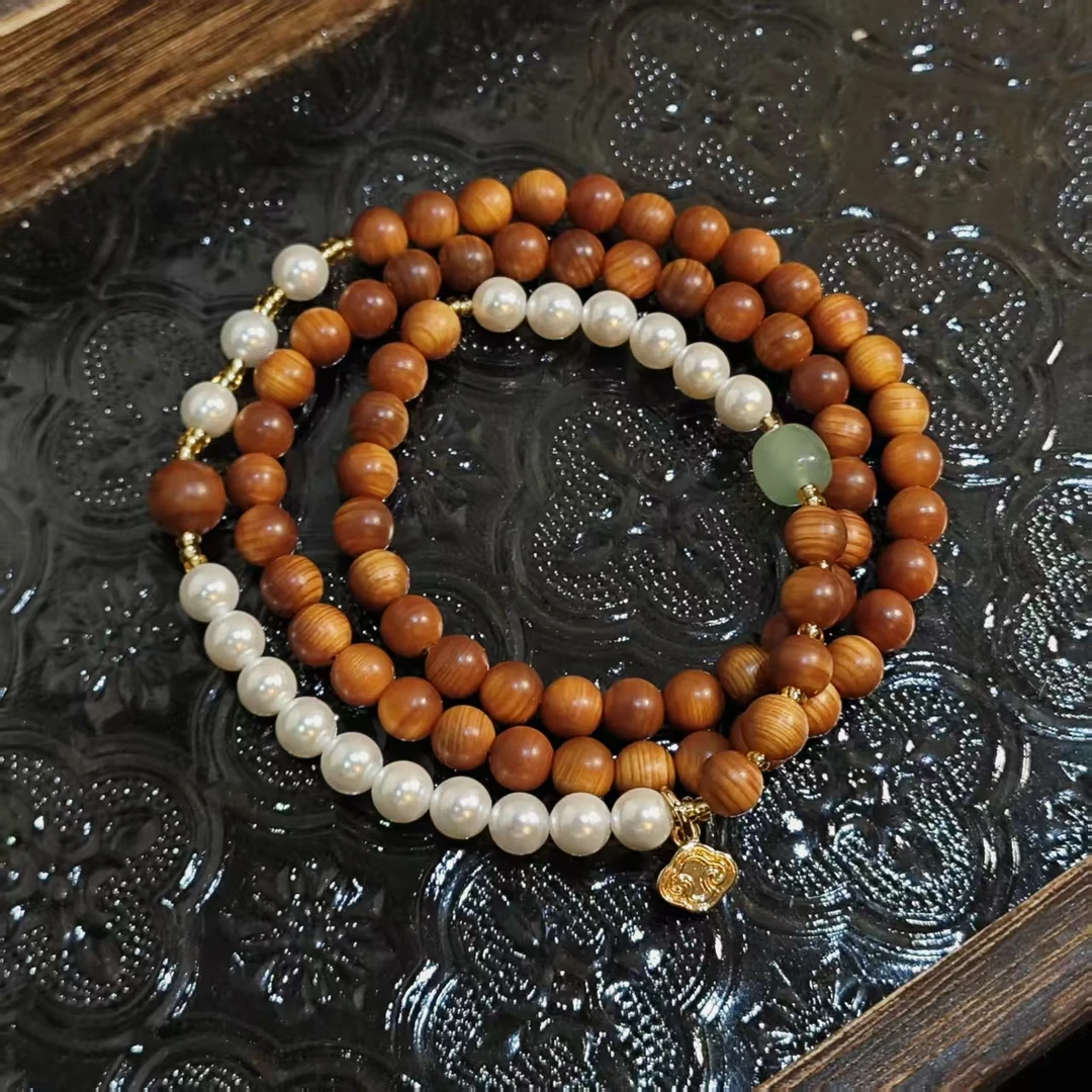 全玉化横纹崖柏6mm 顶珠8mm 贝珠+金丝玉多圈手串