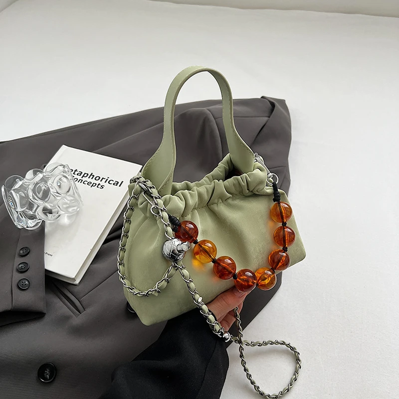 手拎水桶包女2025夏季ins简约PU单肩斜挎小众高级感黑色磁扣手机