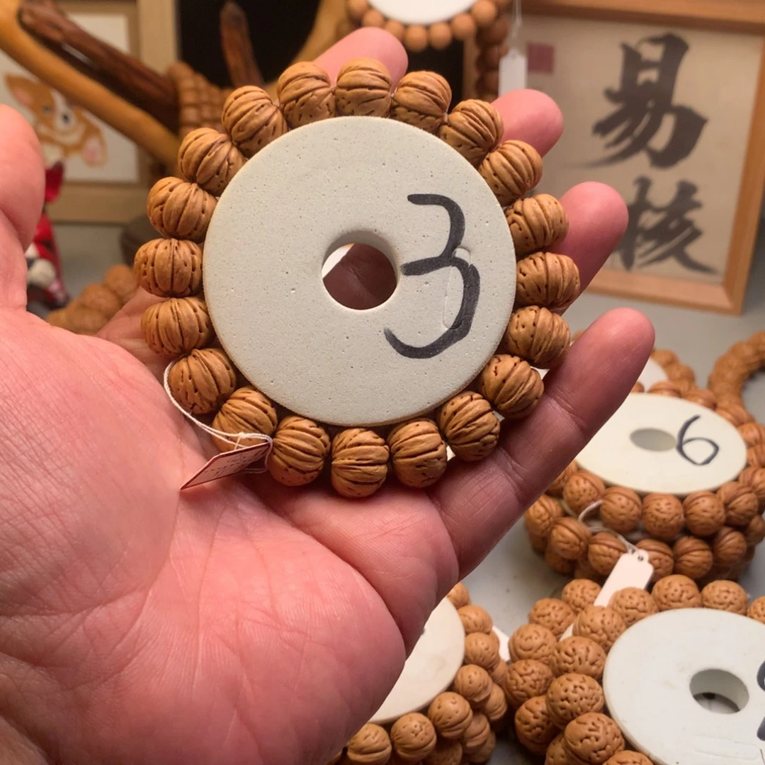 乌***斯手串桃核1.6树王纽扣桃核手串
