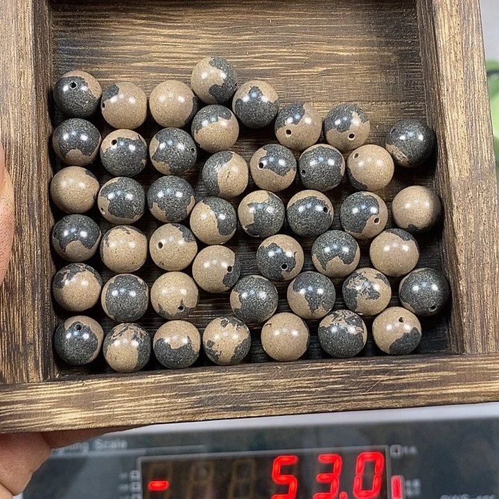 泥塑敦煌黑白龙涎1.2瑕疵珠香包约45克