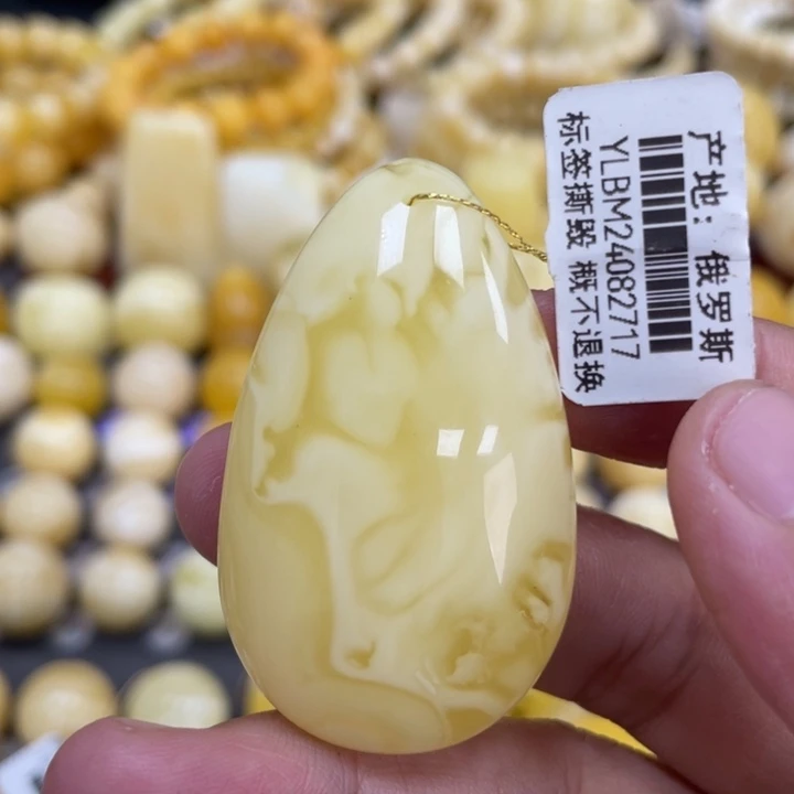 蜜蜡未镶嵌裸石48*29*12mm妖花瑕疵水滴