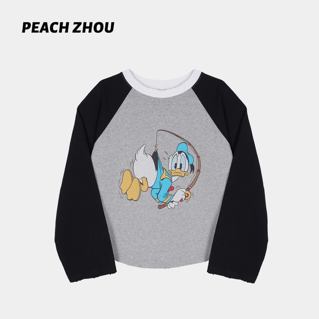 『PEACHZHOU』撞色插肩唐老鸭卡通印花磨破休闲减龄宽松圆领长袖女
