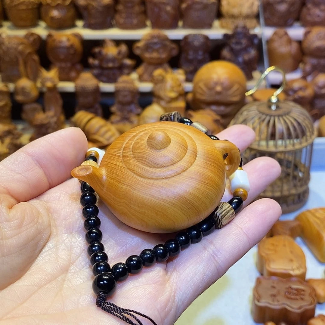 小***时木崖柏木雕手把件