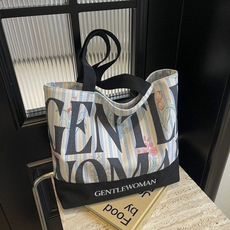 时尚手提字母帆布包包新款小众大容量大学生上课通勤单肩托特包LX