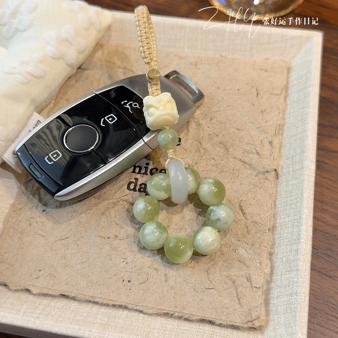 青狮御守·国风设计款青提奶盖岫玉挂件醒狮头汽车钥匙扣车载挂饰