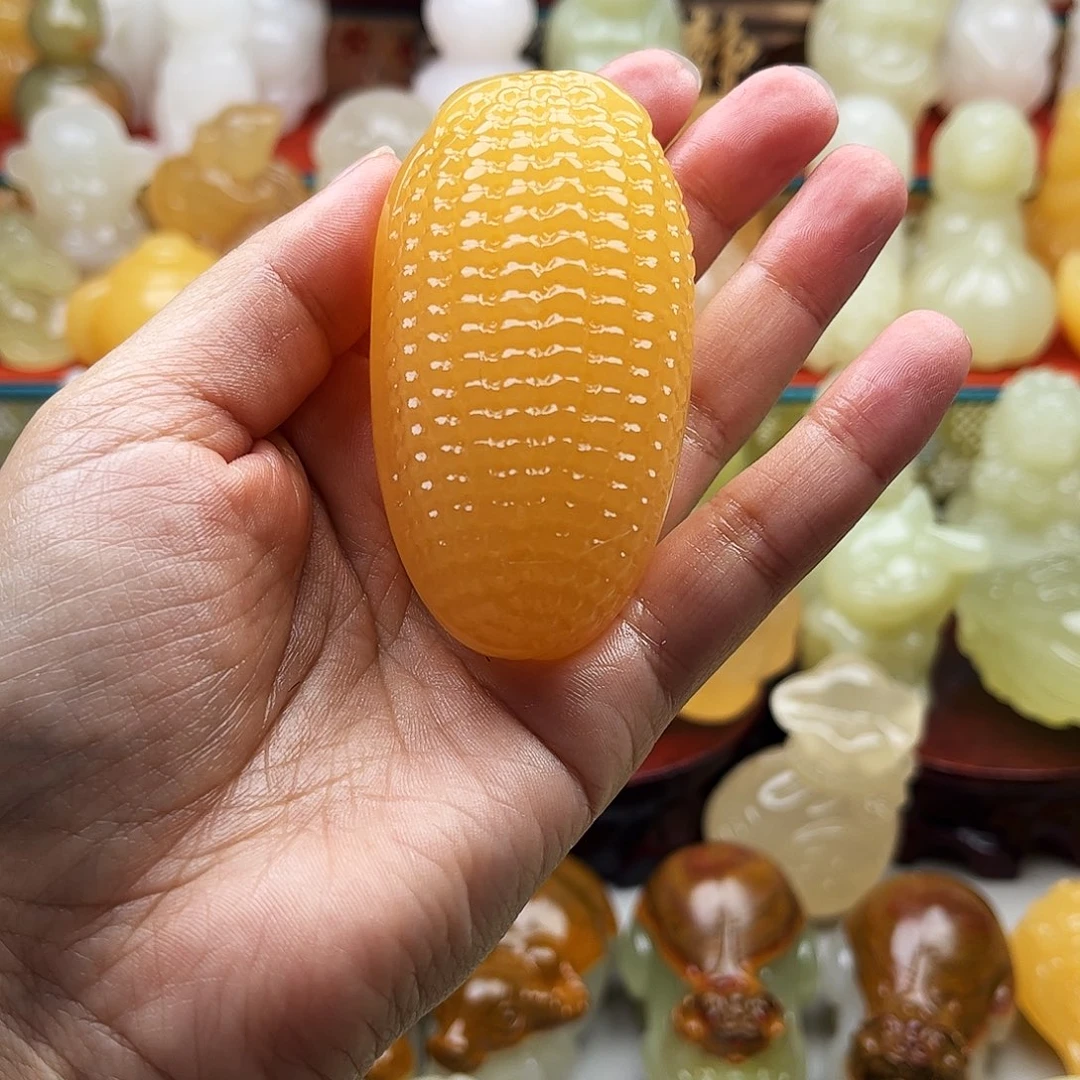 郑***~石材玉米手把摆件