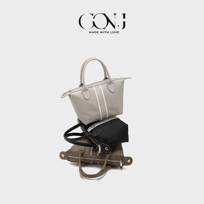 CON.J2025新款轻奢小众手感好皮质软女手提单肩简约实用饺子包