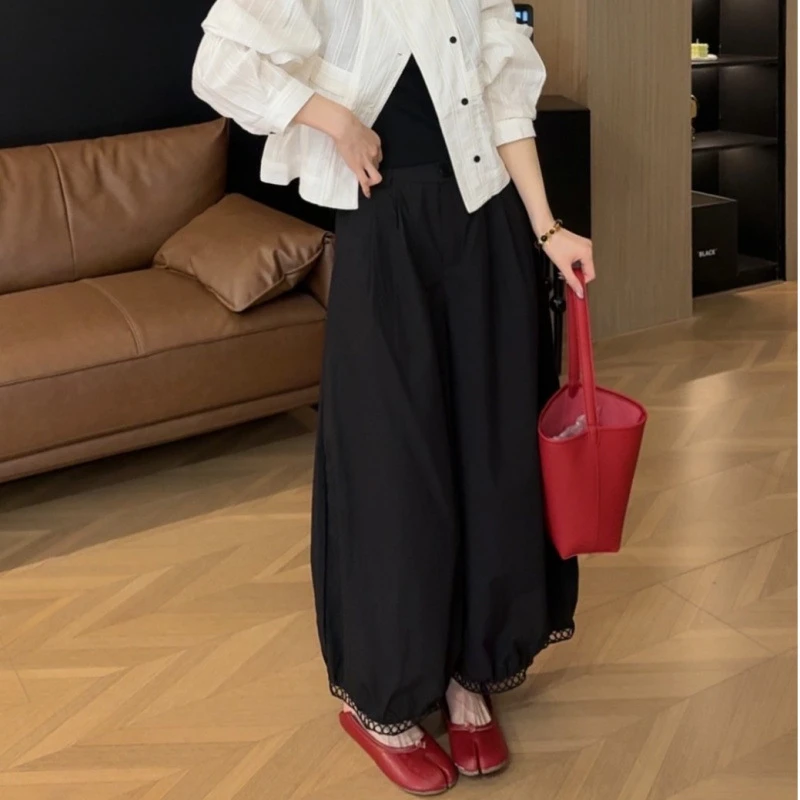 薇薇绮时尚纯色阔腿裤脚拼接镂空设计灯笼裤新款