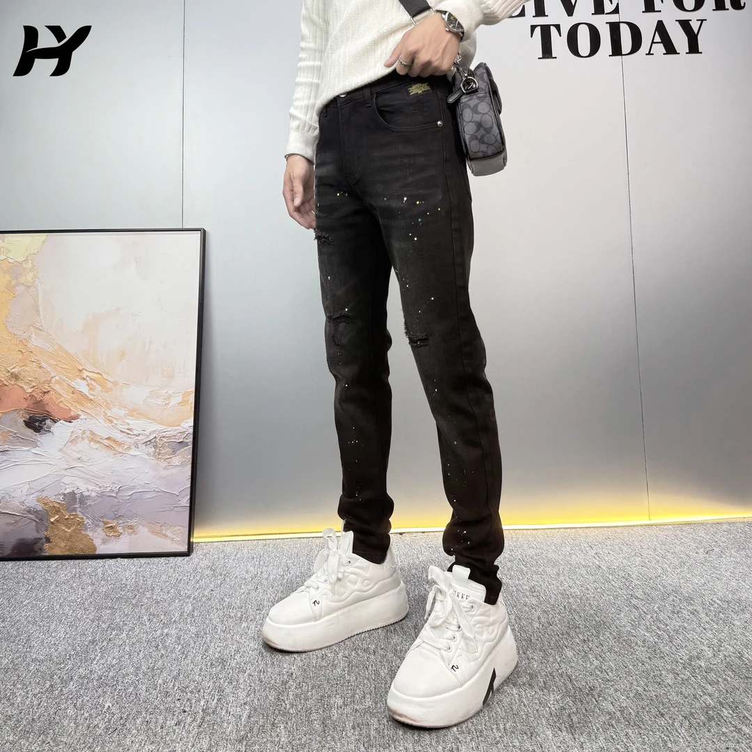 黑色痞帅贴布破洞泼墨牛仔裤秋冬高品质潮流时尚百搭小脚长裤子男