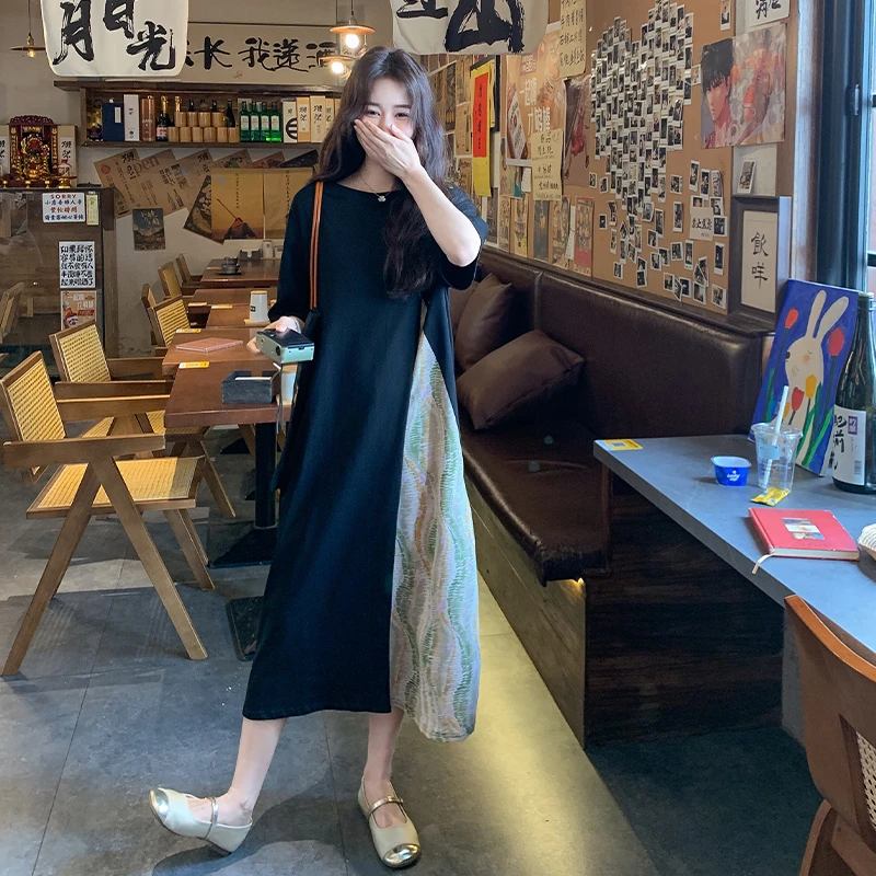 黑色撞色拼接假两件连衣裙女2025夏休闲新款韩系民族风法式长裙子