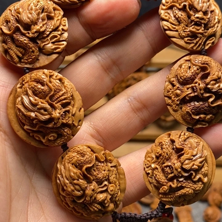 本***双桃核手工雕刻九龙