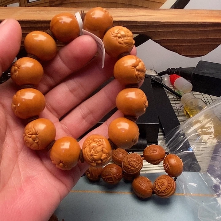 森***装橄榄核吊坠橄榄核雕刻财迷手