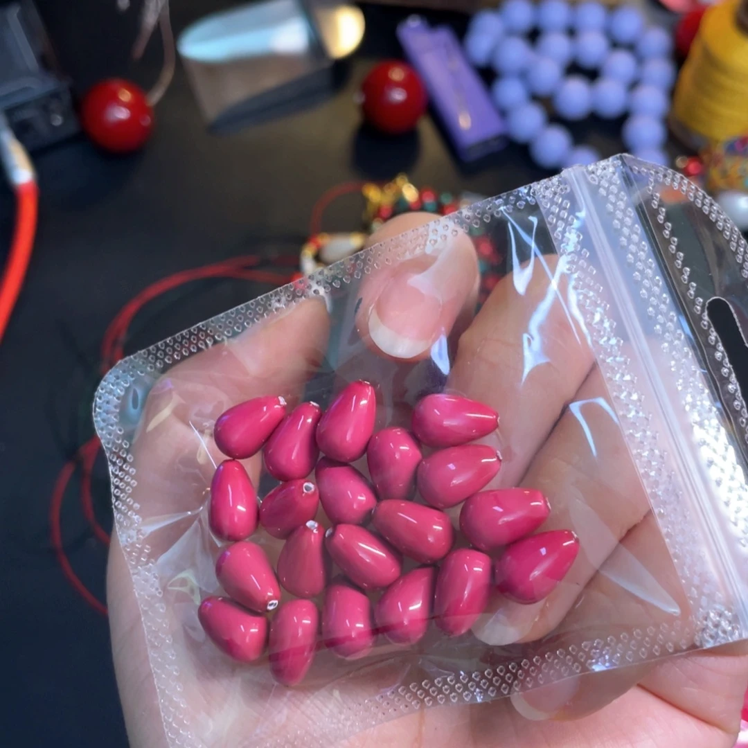 毓***墨玫粉色水滴半孔20粒