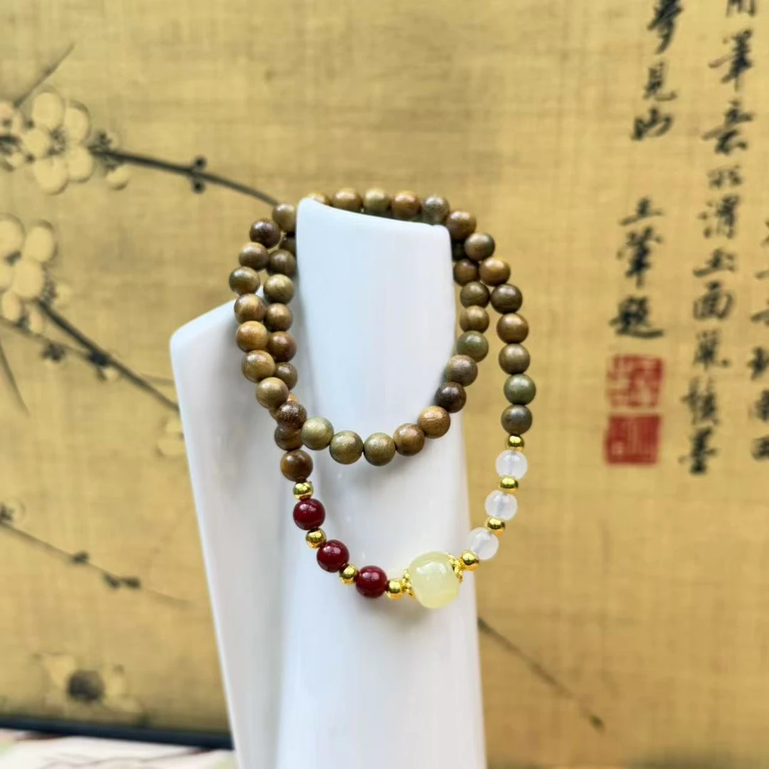 DA-1137-绿檀带金珠朱砂玉色隔珠