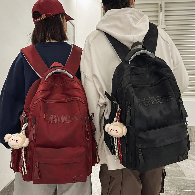 高中生初中生减负书包休闲大容量男生电脑背包简约潮流女生双肩包