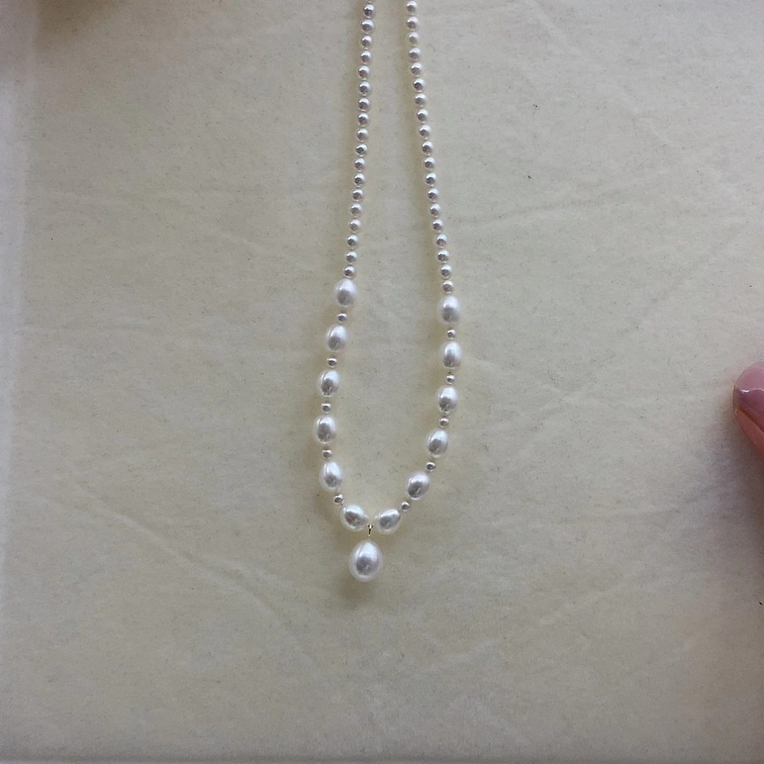 淡水珍珠银S925镶嵌耳饰