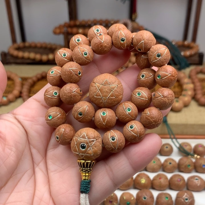 宠***店凤眼菩提吊坠手持