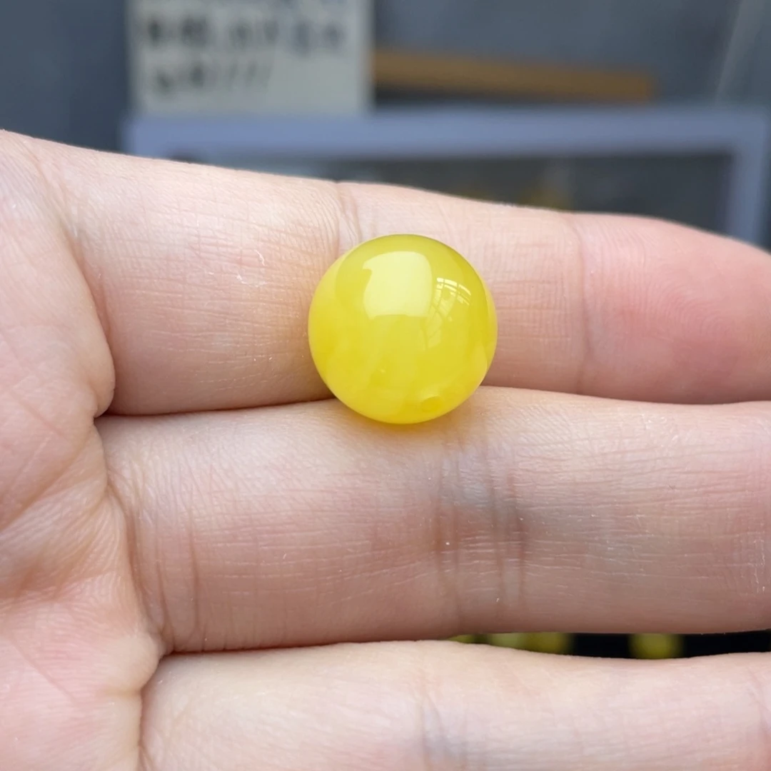 7***叔蜜蜡未镶嵌珠宝奇石圆珠一颗约14毫米多微瑕疵