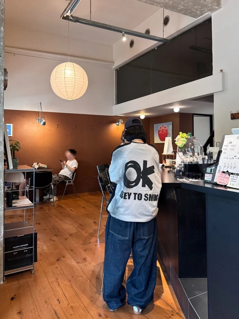 韩版复古街头嘻哈潮流宽松运动水洗做旧喷绘字母印花拼接长袖T恤