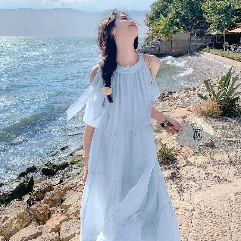 粉色露肩连衣裙夏季女2025新款防晒度假风宽松显瘦甜美长款挂脖裙