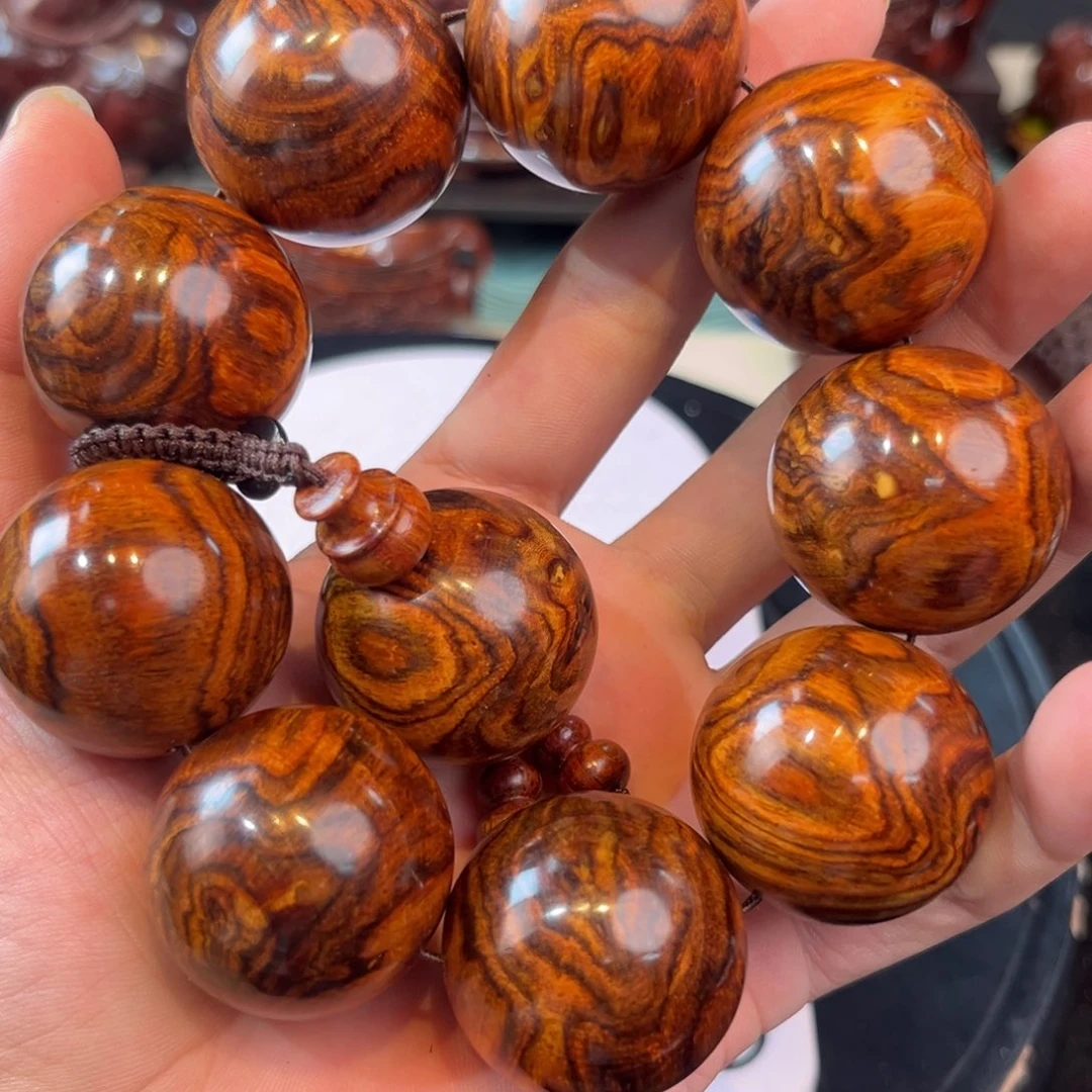 小***晖海南黄花梨手把件