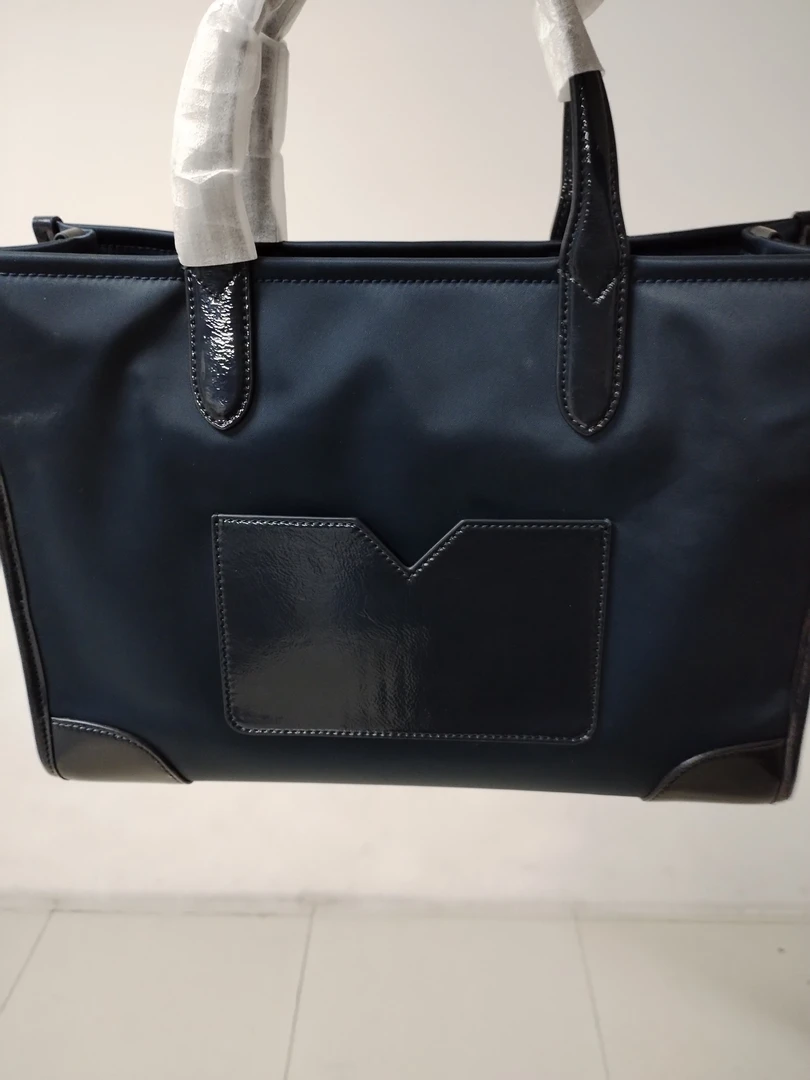 马鞍形松紧款蓝色电脑包拉链手提包车缝线手拿包