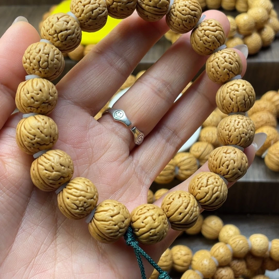 桃核手串春肉纹元宝