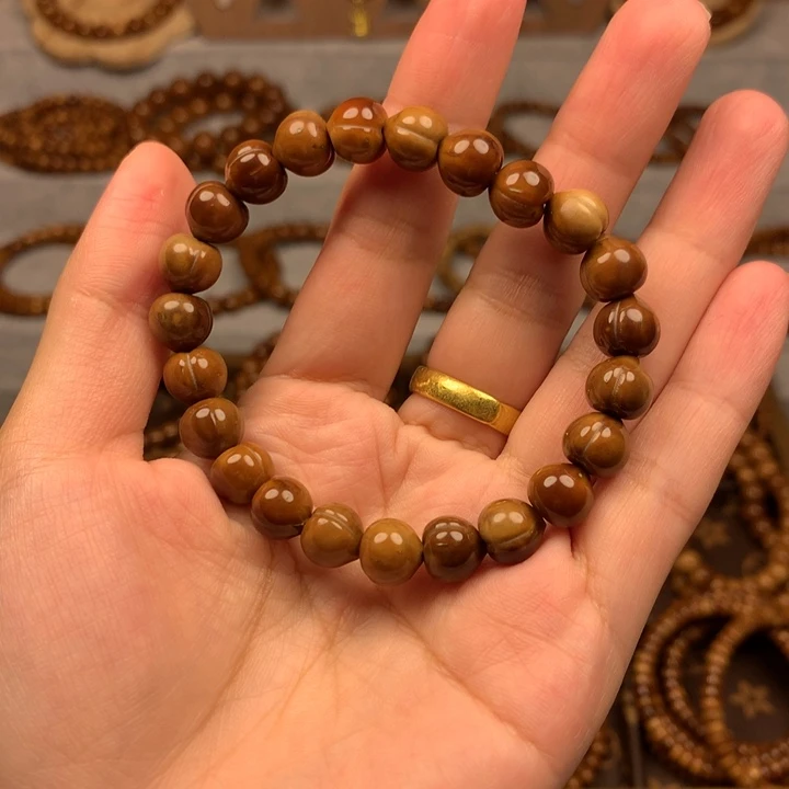 果皮天然库克精挑8*9屁桃单手串