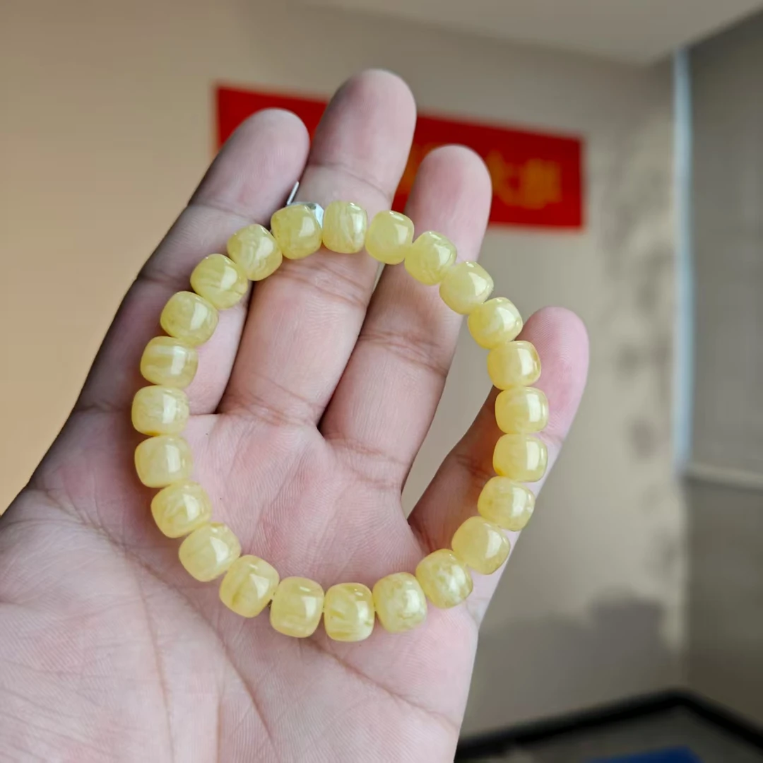 约7*8mm俄料鸡油黄白花纹蜜蜡精工归圆老型珠单圈手串