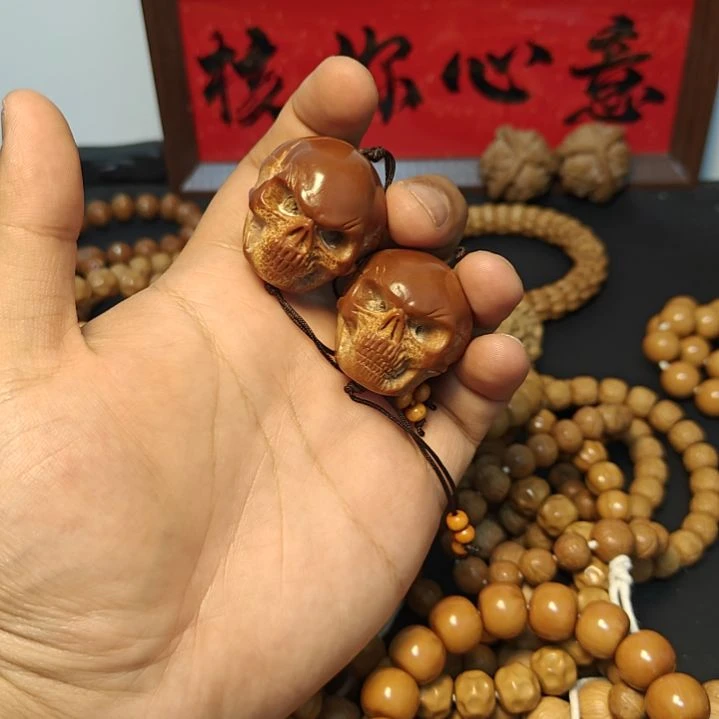 无铁合金巴西橄榄核雕刻骷髅头 一对