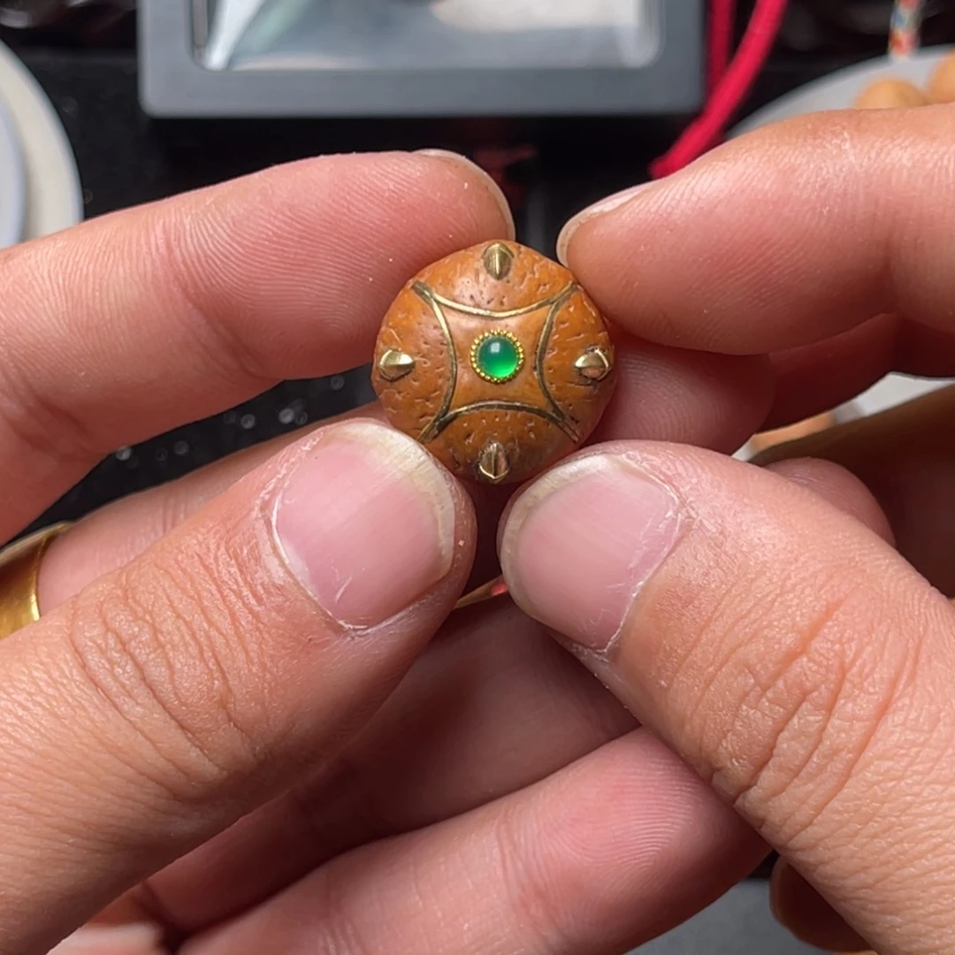 九***。凤眼菩提手串19单颗麒麟三通镶嵌