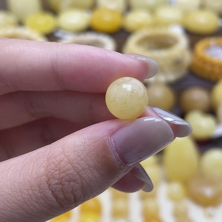 琥珀未镶嵌裸石10.6mm金白妖花圆珠瑕
