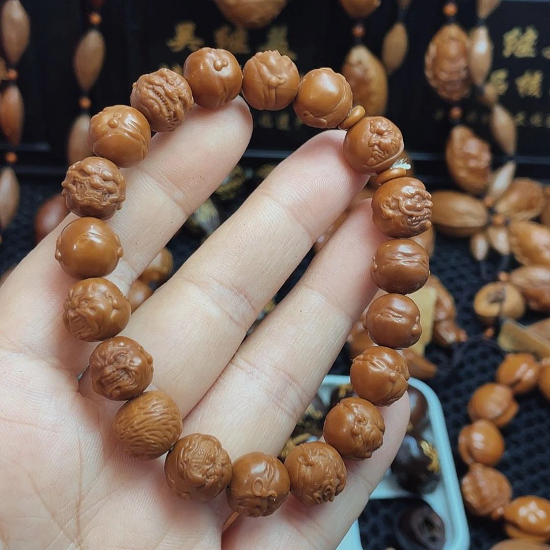橄榄核吊坠使**了恶僧手串