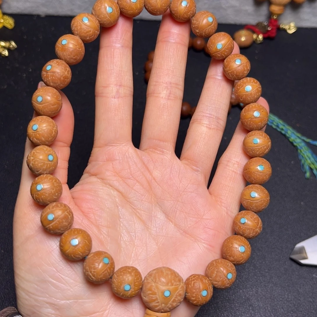 凤眼菩提吊坠小*12+mm精品松丁27颗手持