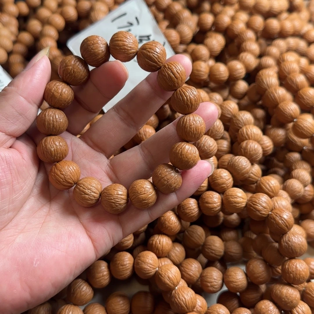 桃核手串凤羽猴头手串