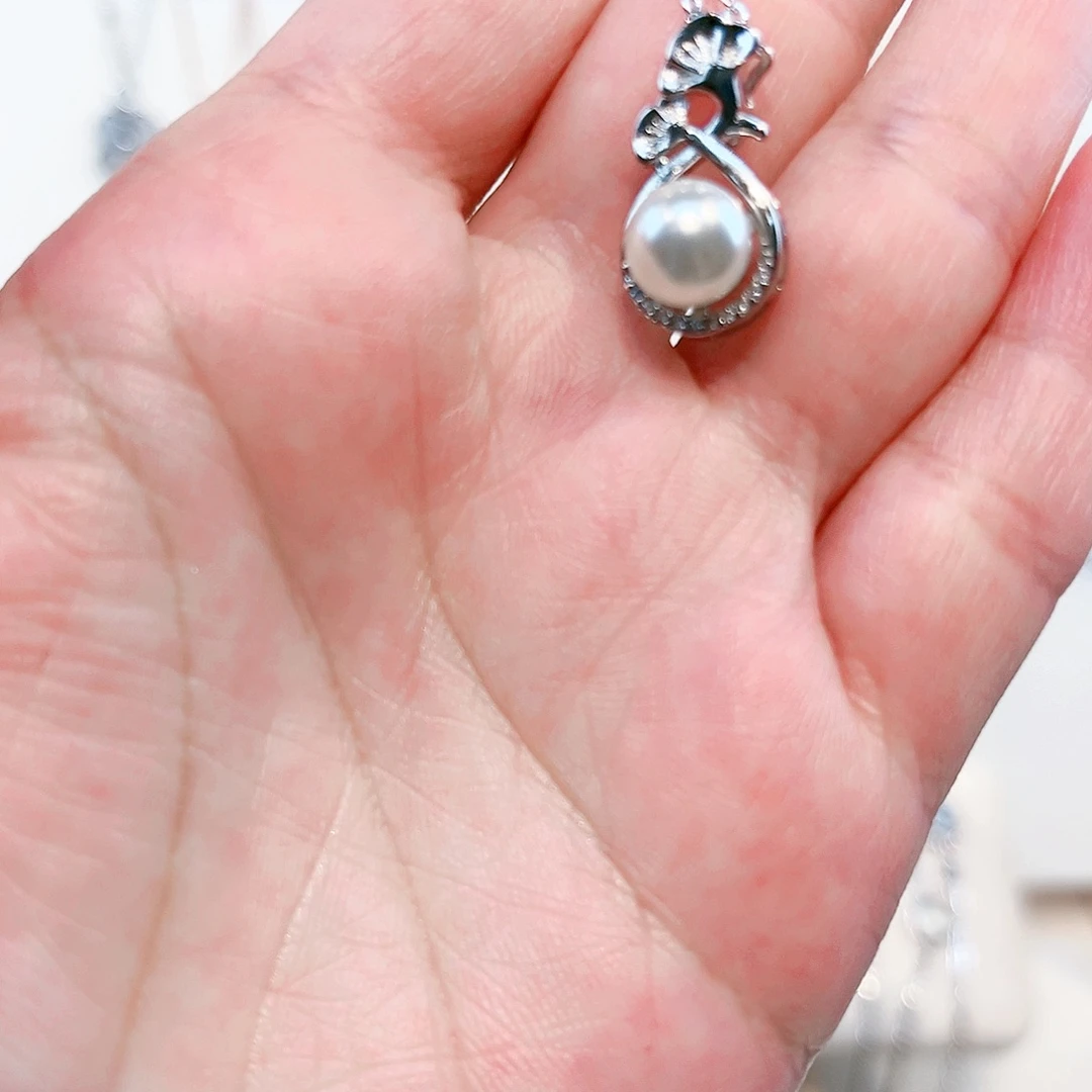 浪***子吊坠(赠链)淡水珍珠足银镶嵌