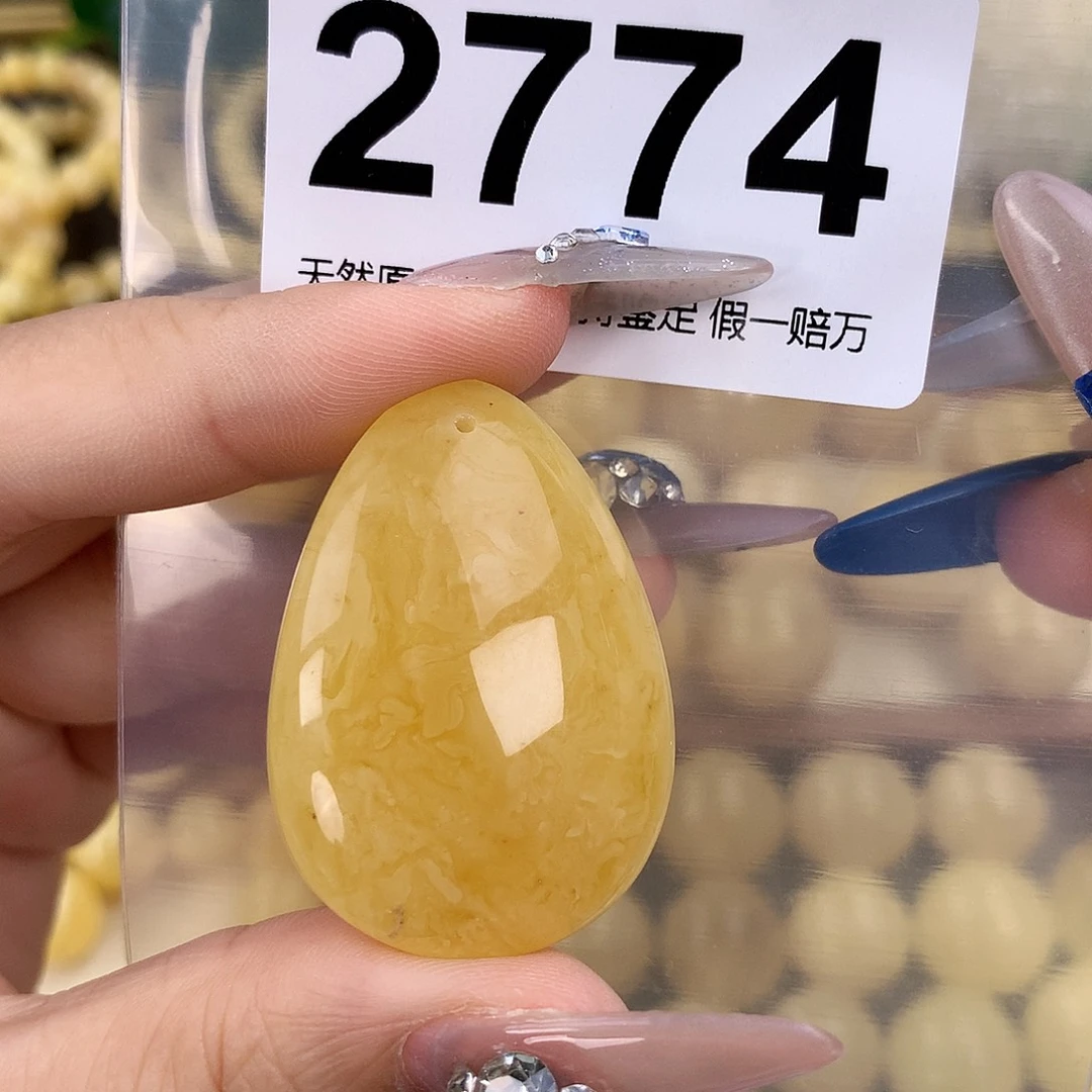 蜜蜡未镶嵌珠宝奇石高40.7，宽28.8