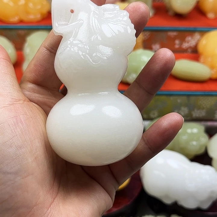 老***猫石材新疆山料葫芦手把摆件