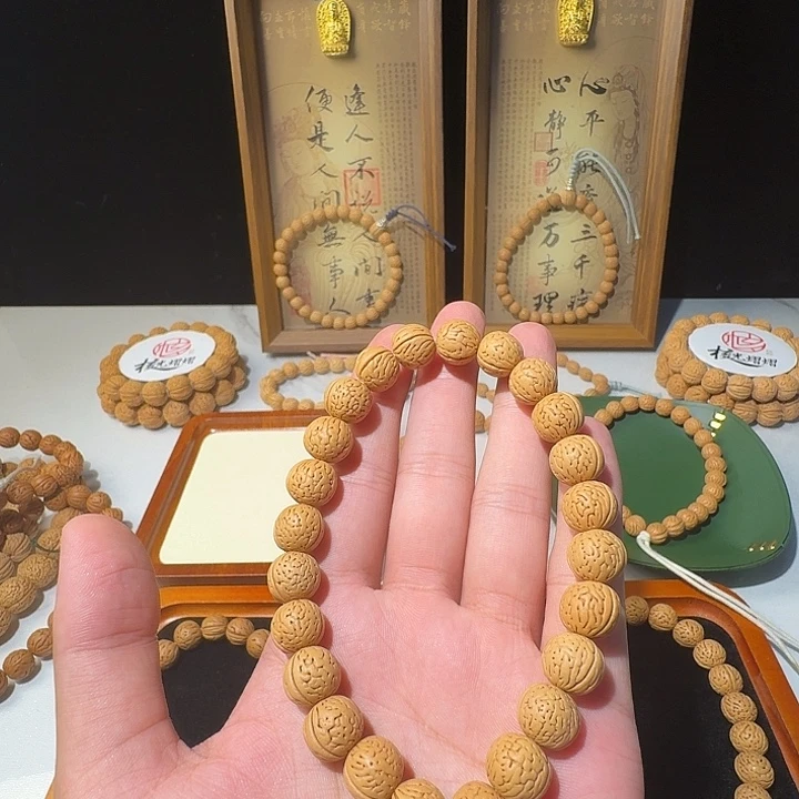 去***࿐手串桃核野生密纹大开脐