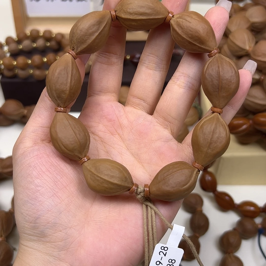 爱***差橄榄核手串/手链三花19.28