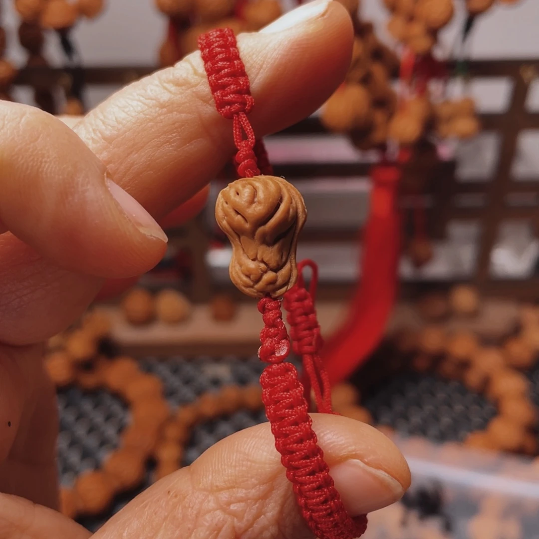 玉***心木质类龙纹桃枭手串