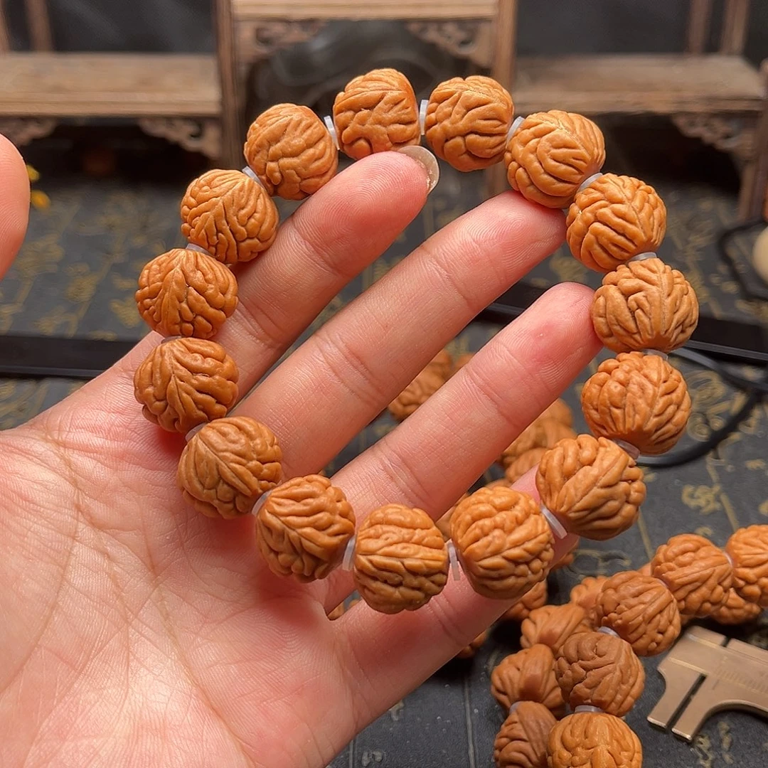 桃核吊坠包子头手串