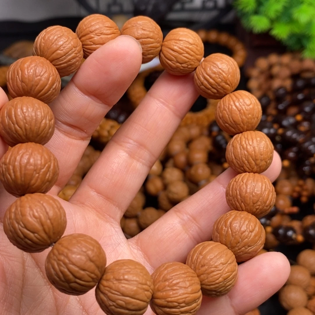 惠***凯菩提籽类橄榄核雕刻手串手链项链吊坠