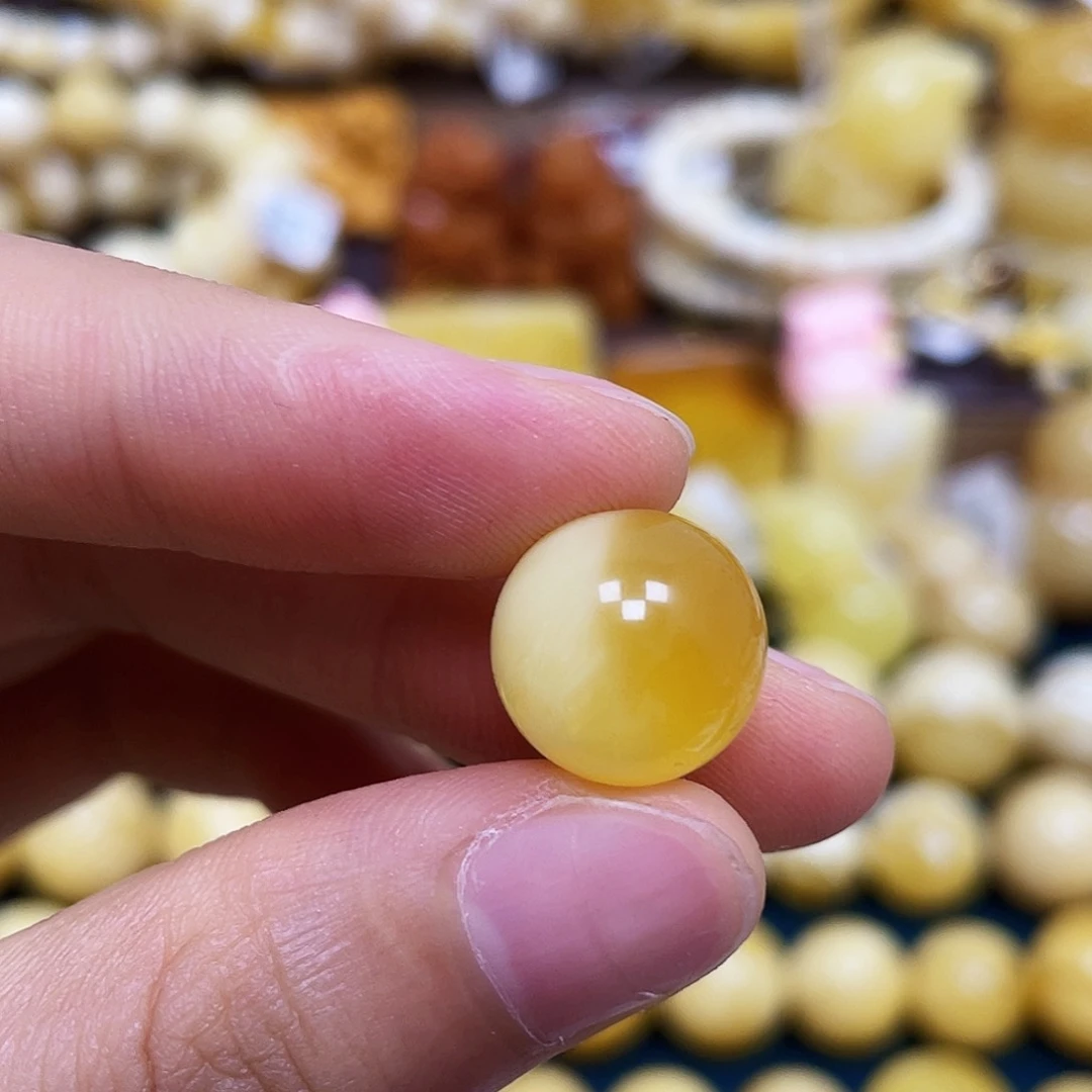 嗨***串未镶嵌琥珀珠宝奇石13.2mm.圆珠.瑕