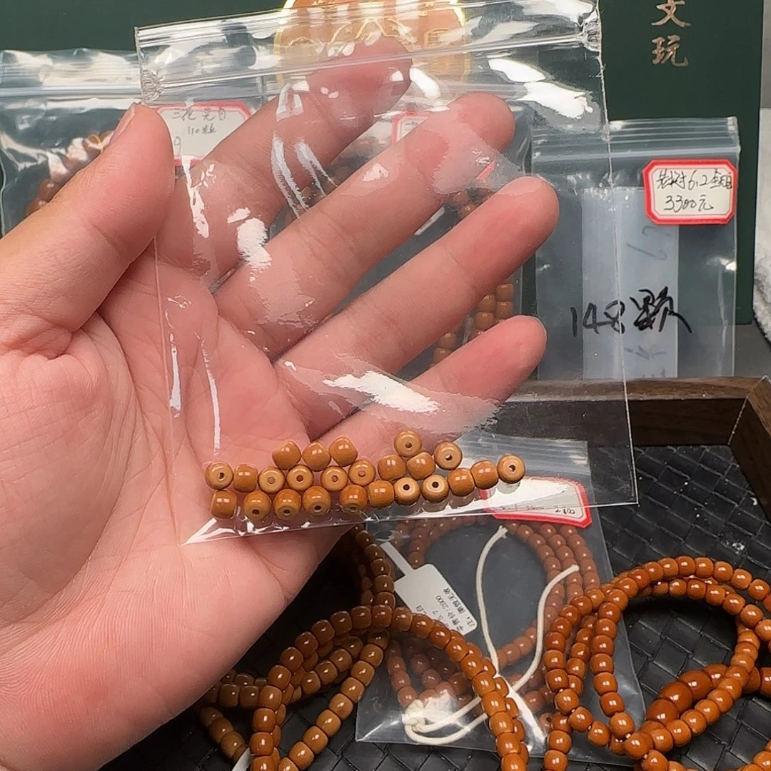 胡***。手串/手链橄榄核6.3mm老挝核尖极限弧单籽24颗