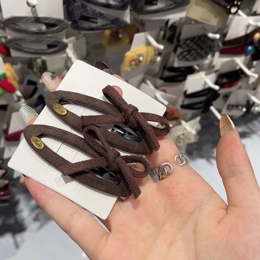 皮质铁合金椭圆深咖蝴蝶结拜拜