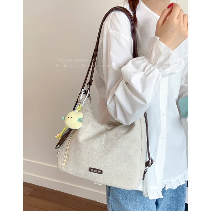 休闲简约通勤帆布包包女式2025新款单肩包大容量多功能双肩托特包