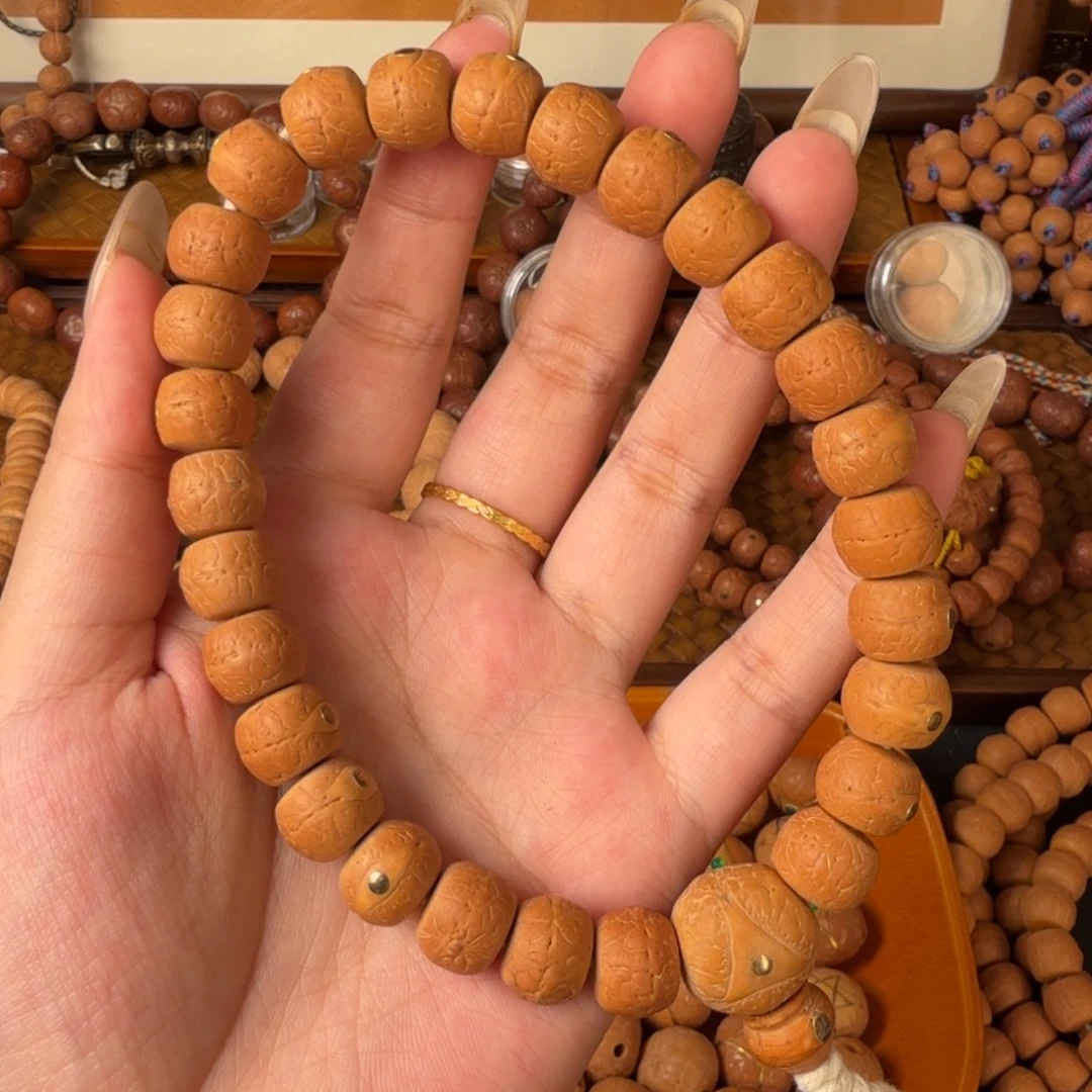 凤眼菩提把件12mm精工藏式27颗 铜钉